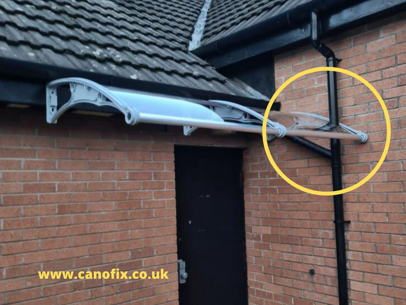 How to install a canopy on a wall that has a down pipe?